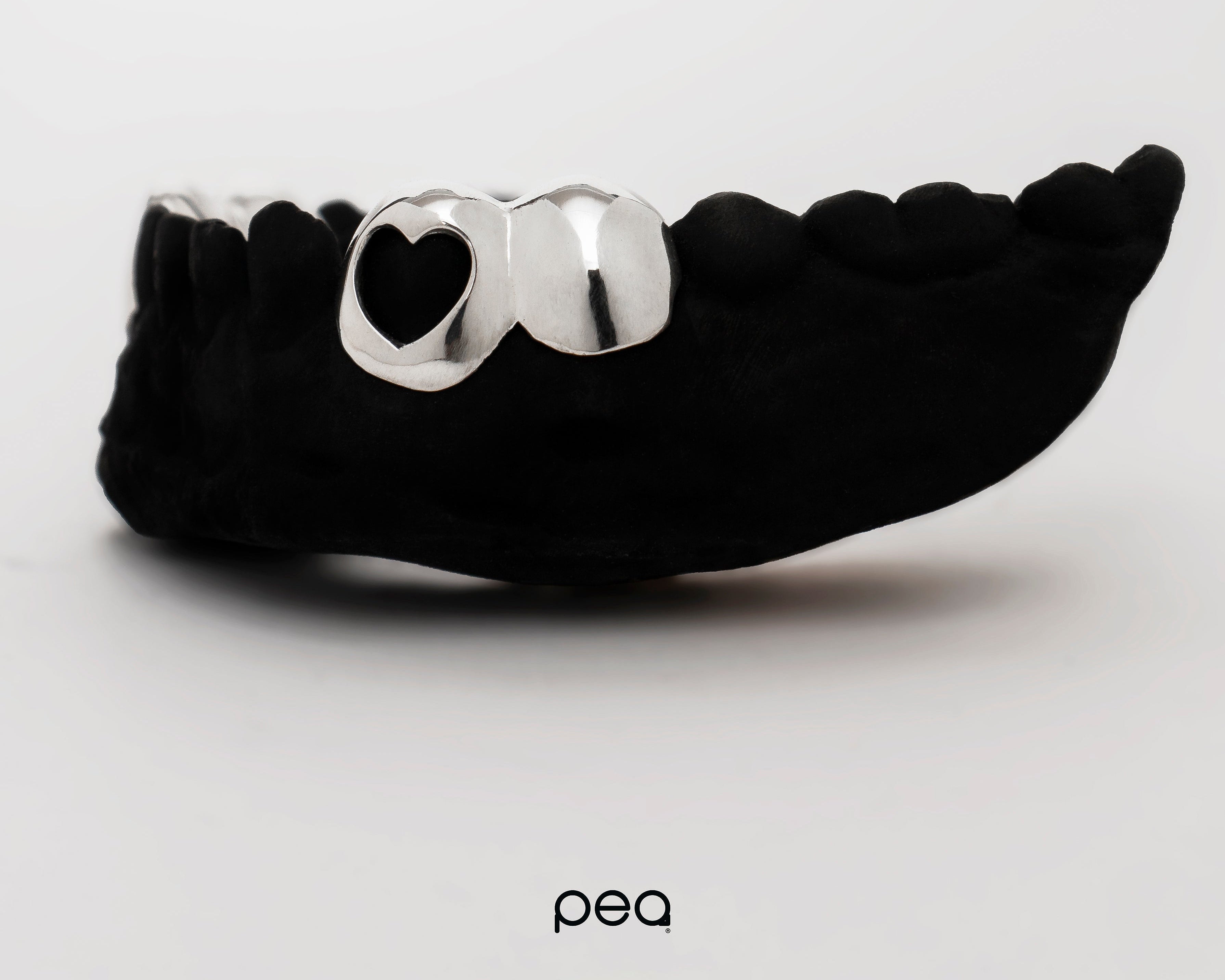 2 Teeth (heart cut-out)